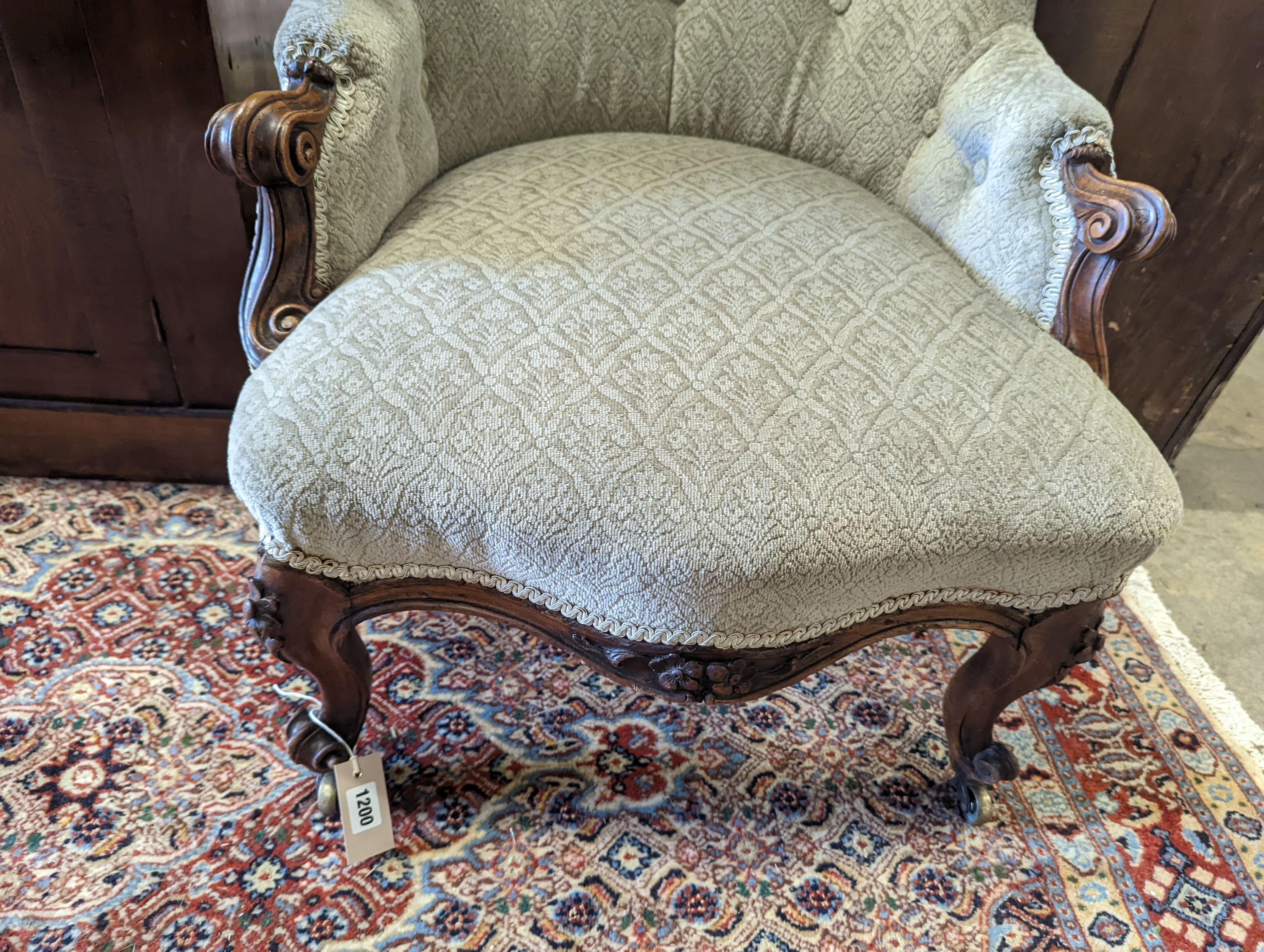 A Victorian carved walnut spoonback chair, width 62cm, depth 75cm, height 80cm